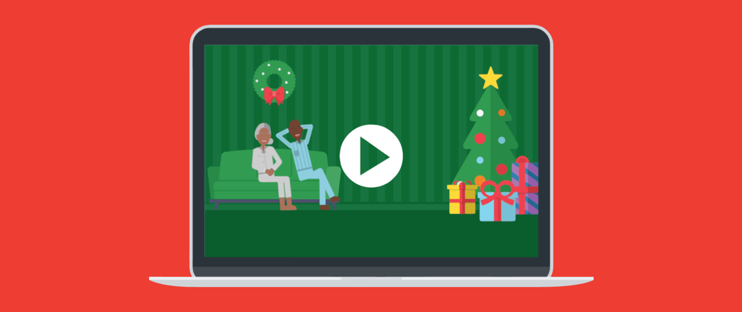 A laptop showing a full-screen holiday-themed video thumbnail.